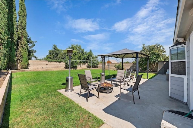 view of patio featuring an outdoor fire pit and a gazebo