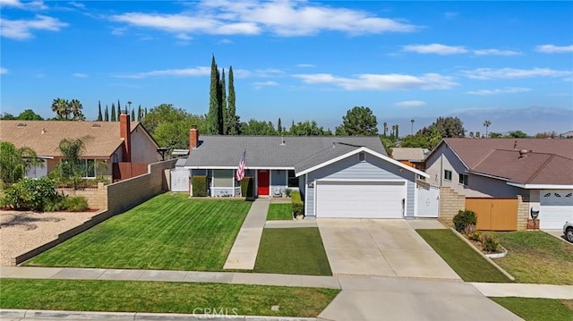 ranch-style home featuring a garage and a front lawn