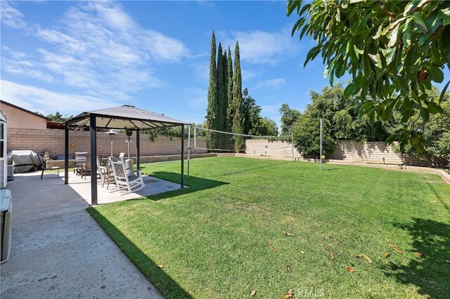 view of yard featuring a patio area and a gazebo