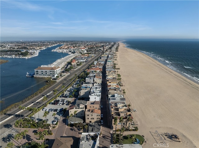 aerial view featuring a water view and a beach view