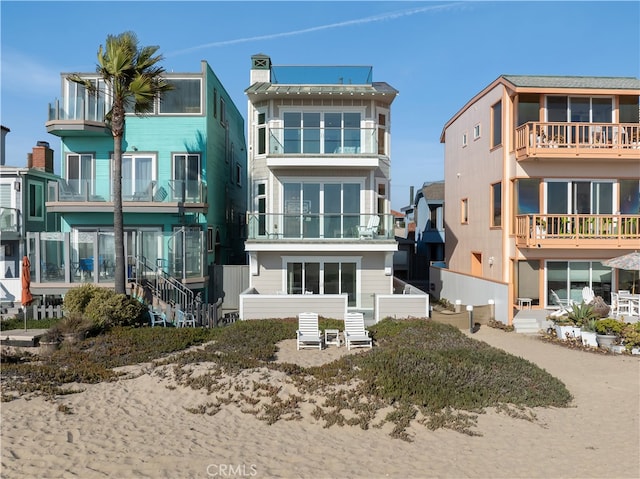 back of property with a balcony