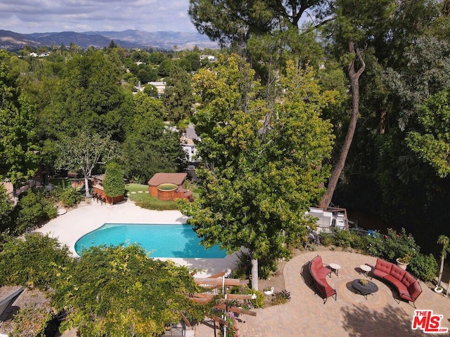 birds eye view of property featuring a mountain view