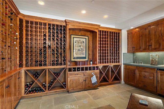 wine area with sink and wooden ceiling