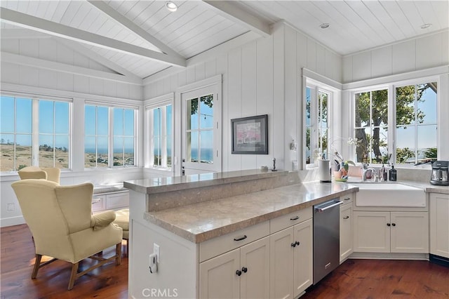 kitchen with vaulted ceiling with beams, sink, white cabinets, and dark wood-type flooring