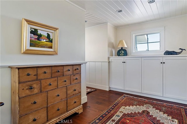 interior space with crown molding and dark hardwood / wood-style flooring