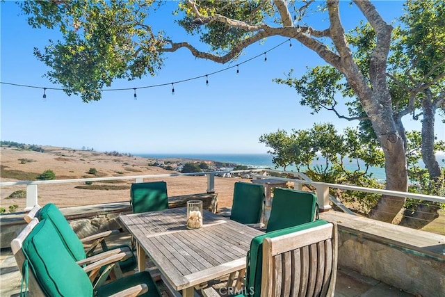 wooden deck with a water view