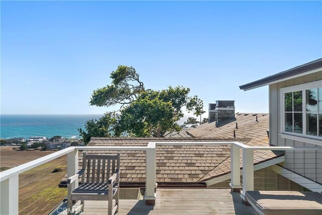 wooden deck featuring a water view and grilling area