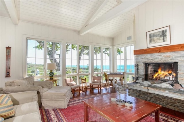 sunroom / solarium with visible vents and lofted ceiling with beams