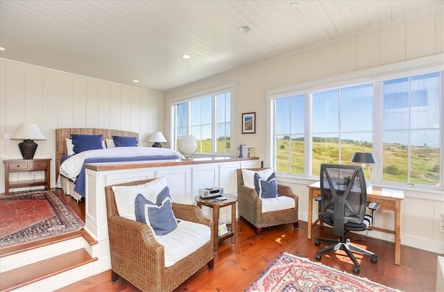 bedroom with wood ceiling and wood finished floors