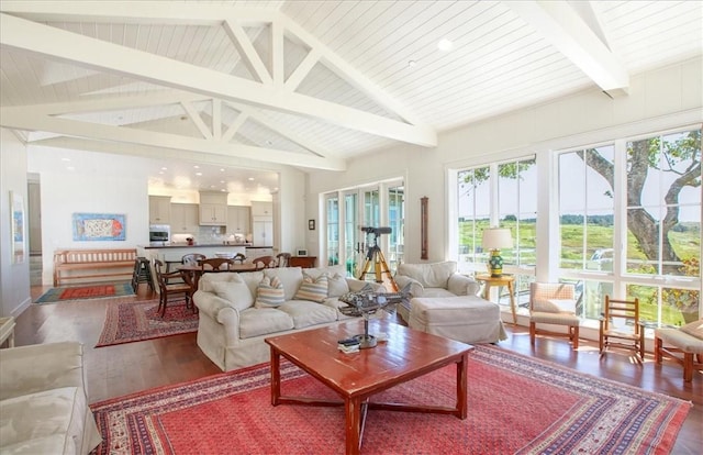 sunroom / solarium featuring beamed ceiling
