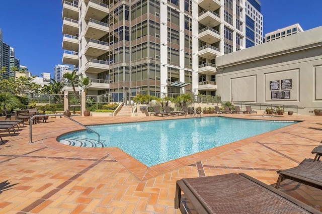 view of pool featuring a patio