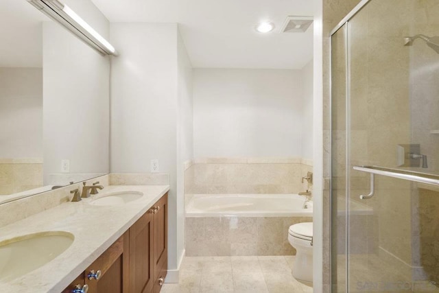 full bathroom featuring tile patterned floors, separate shower and tub, vanity, and toilet