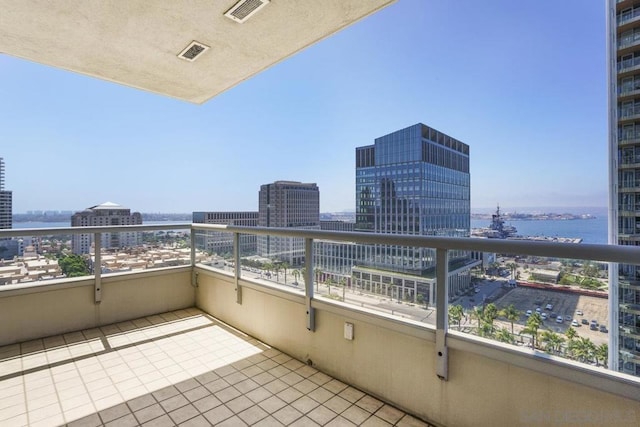 balcony featuring a water view