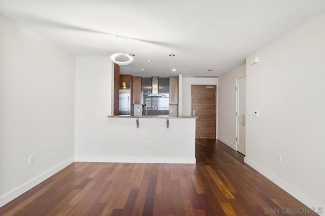 interior space with dark hardwood / wood-style flooring and sink