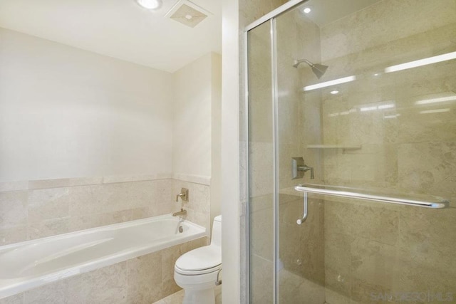 bathroom featuring separate shower and tub and toilet