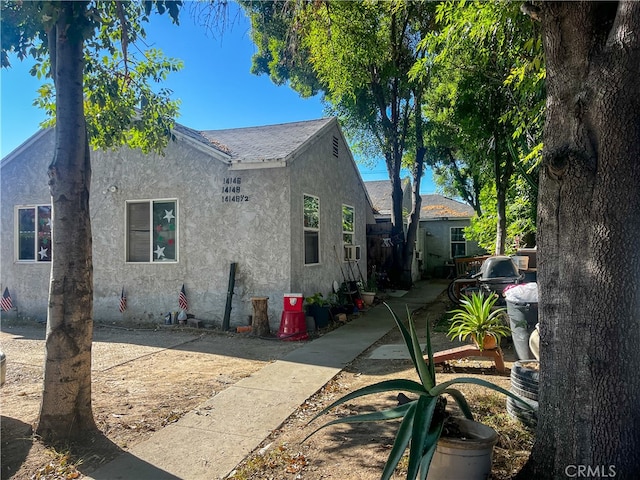 view of side of home with a patio area