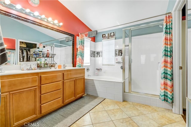 bathroom with vanity, tile patterned flooring, vaulted ceiling, and separate shower and tub