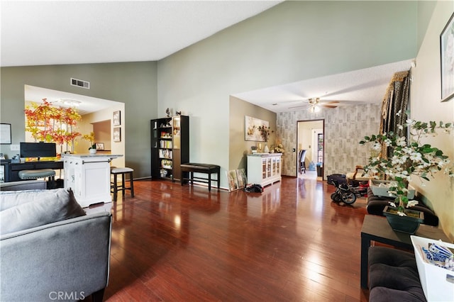 living room with wood-type flooring, ceiling fan, and high vaulted ceiling