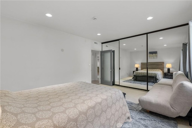 carpeted bedroom featuring a closet