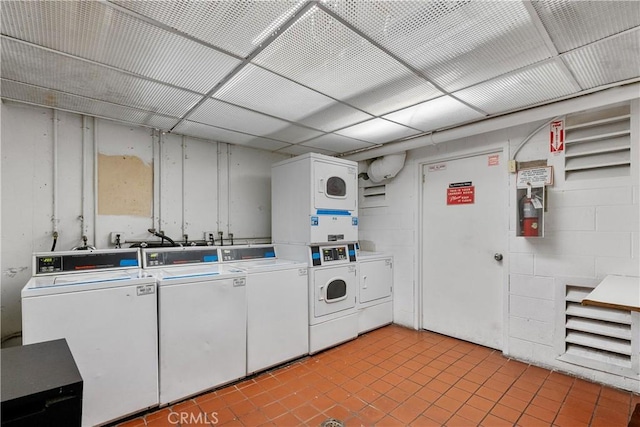 laundry room featuring stacked washer / dryer, separate washer and dryer, and light tile patterned flooring