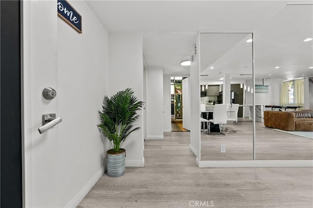 interior space featuring a healthy amount of sunlight and light hardwood / wood-style floors