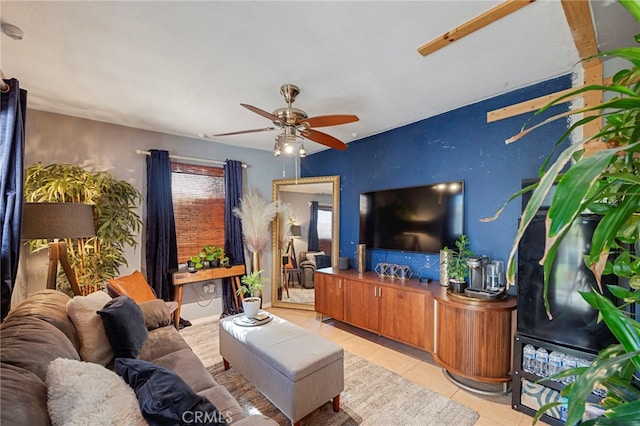 living room featuring ceiling fan and light tile patterned flooring