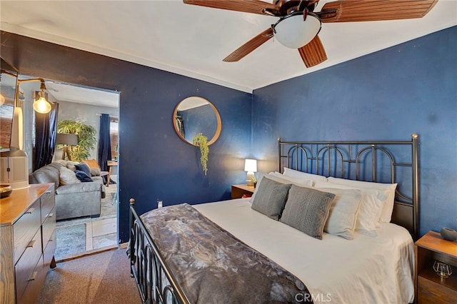 carpeted bedroom with ceiling fan