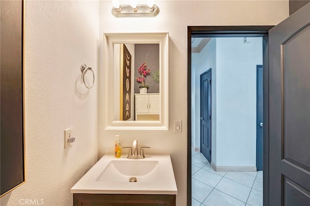 bathroom with tile patterned floors and vanity