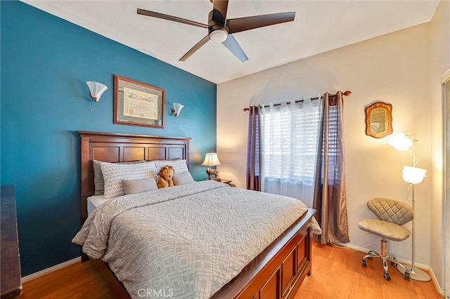 bedroom featuring ceiling fan and light hardwood / wood-style flooring