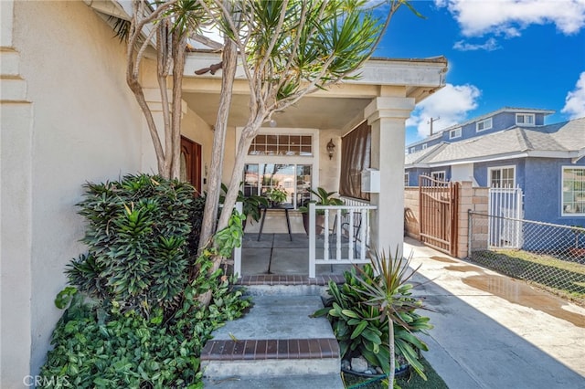 doorway to property with a porch