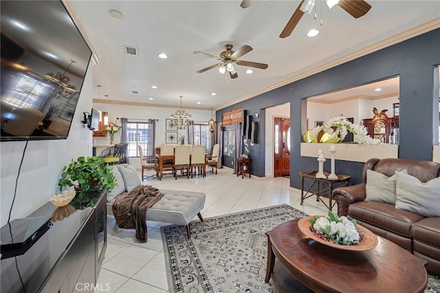 living room featuring light tile patterned floors, ceiling fan with notable chandelier, and crown molding