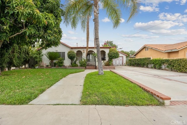 mediterranean / spanish home featuring a front yard