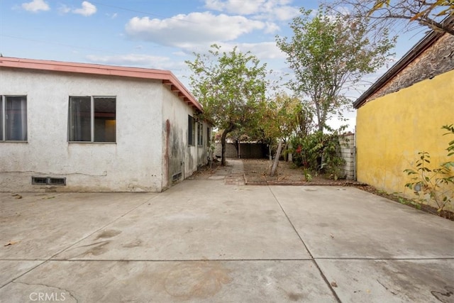 view of property exterior featuring a patio area