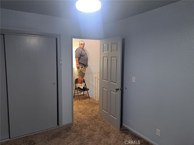 unfurnished bedroom with carpet flooring