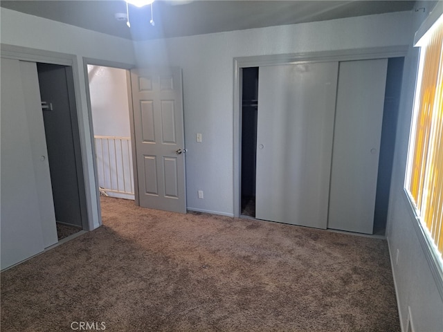 unfurnished bedroom with carpet floors