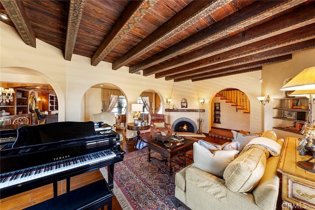 living room featuring wood ceiling, beam ceiling, and hardwood / wood-style floors