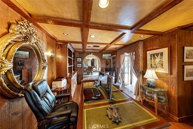 office area with coffered ceiling, wood walls, beamed ceiling, and hardwood / wood-style floors