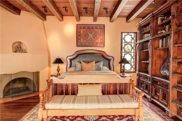 bedroom with wood ceiling, wood-type flooring, and beam ceiling