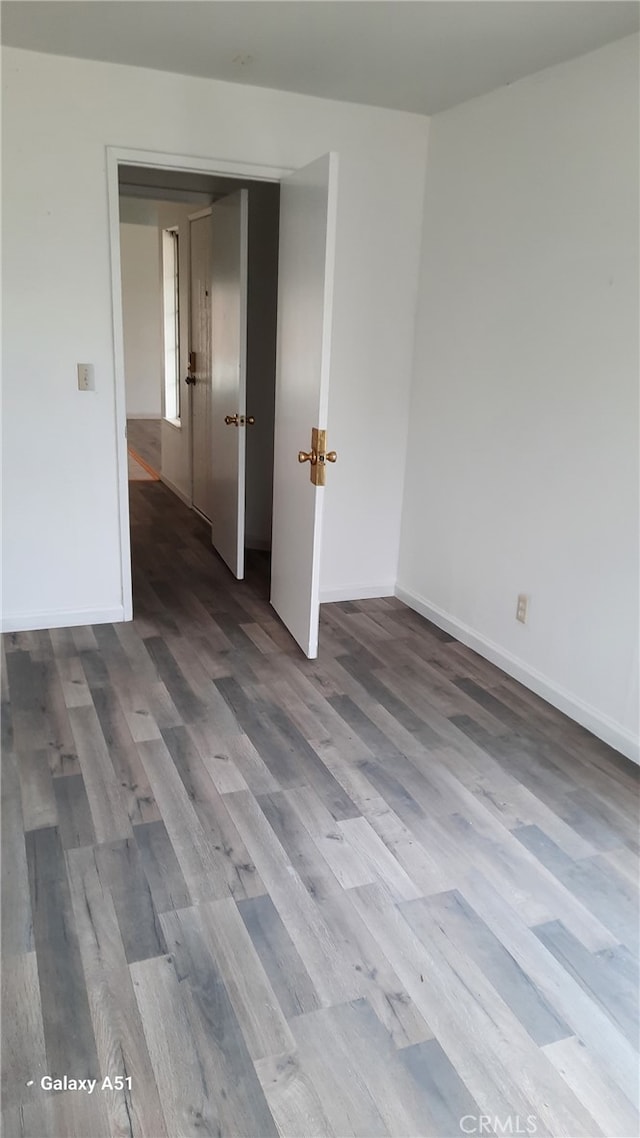 empty room featuring hardwood / wood-style floors