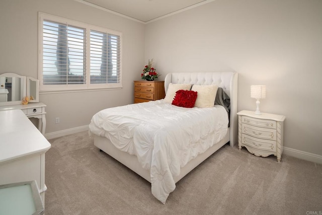 carpeted bedroom featuring crown molding