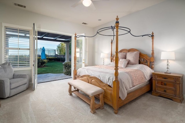 carpeted bedroom featuring ceiling fan and access to exterior