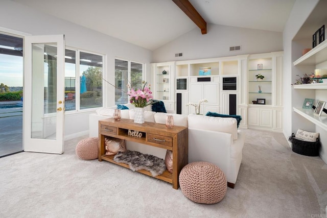 living room featuring french doors, light colored carpet, high vaulted ceiling, built in shelves, and beam ceiling