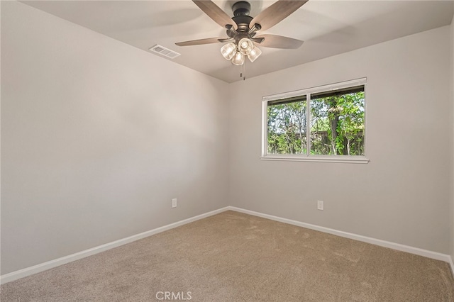 empty room featuring ceiling fan and carpet floors