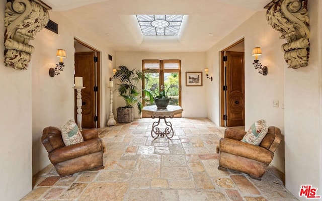 hall featuring a skylight