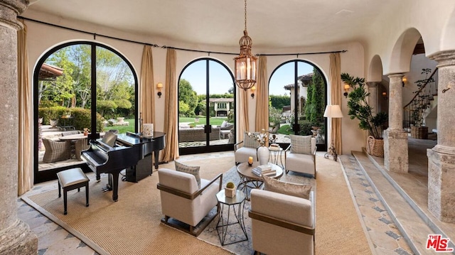 interior space with a notable chandelier and ornate columns