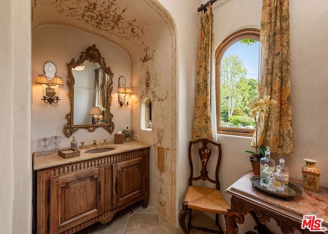 bathroom featuring a healthy amount of sunlight and vanity