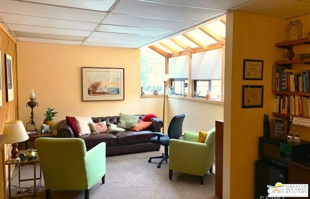 living room with carpet floors and vaulted ceiling