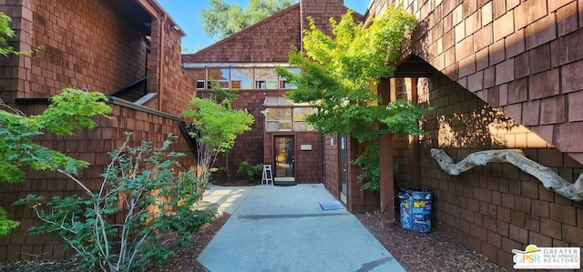 view of property's community with a patio area