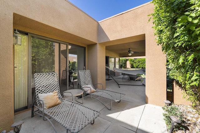 view of patio / terrace featuring ceiling fan