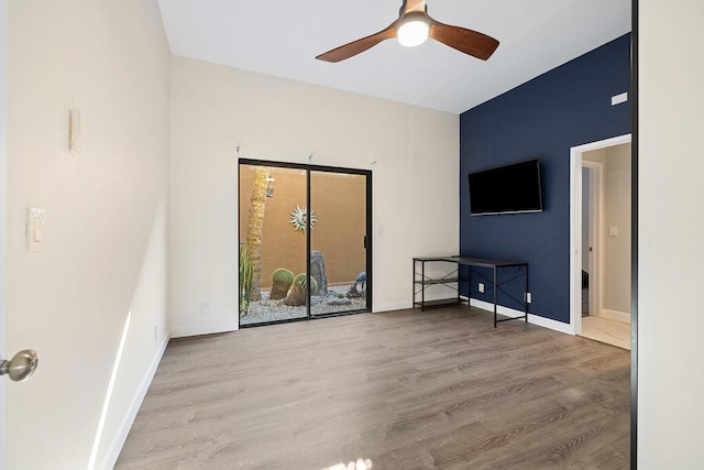 spare room featuring light hardwood / wood-style floors and ceiling fan